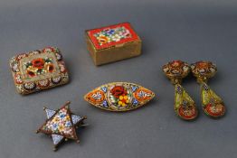 A micro mosaic pill box together with three micro mosaic brooches and a pair of clip on earrings