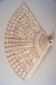 A late 19th century Chinese ivory brise fan,