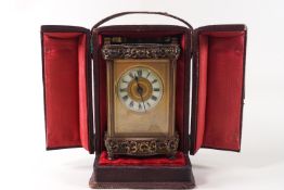A late 19th/early 20th century carriage clock in leather travelling case,