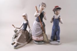 Lladro: a girl with a broom, 23cm high,