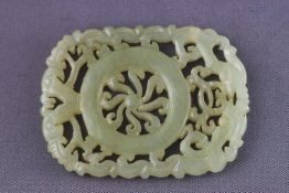 A carved scroll commercial quality jade disc 27.