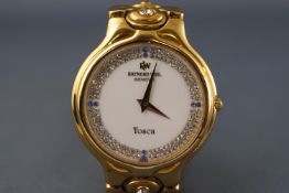 A goldplated Raymond Weil Tosca quartz wristwatch with swarovski set dial and bracelet.