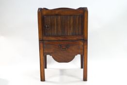 A George III mahogany wash stand with tambour style door to front and pull out drawer base,