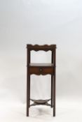 A George III style two tier washstand with drawer and undershelf,