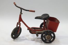 A 20th century child's trike, painted in red and black,
