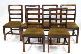 A set of six 19th century mahogany ladder back dining chairs with green upholstered drop -in seats