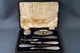 A silver manicure set, in fitted leather case,