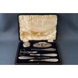 A silver manicure set, in fitted leather case,