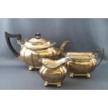 A silver three piece tea set, of boat form on four ball feet, by John Round & Son Ltd,