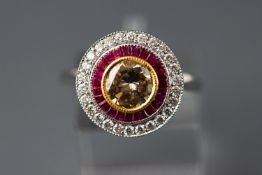 An 18ct white gold ruby and diamond target Art Deco style ring.