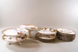 A Victorian Doulton porcelain dessert service, painted with birds among flowering plants,