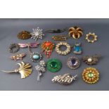 A collection of twenty costume jewellery brooches,