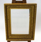 A rectangular giltwood wall mirror with moulded Classical leaf decoration,
