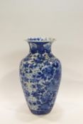 A large Chinese porcelain vase, painted in underglaze blue with birds in flowering branches,