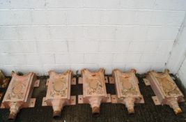 A set of five Victorian cast iron hoppers,