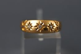 An 18ct and diamond gypsy ring. Hallmarked 18ct gold, Birmingham, 1898 Size: P 1/2 2.
