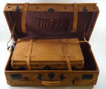 A set of two camel brown leather suitcases, the smaller 53cm x 29.5cm, the larger 68.