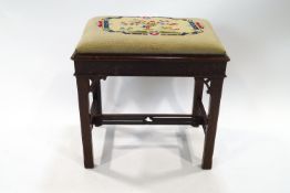 A Chippendale style mahogany stool with tapestry drop in seat,