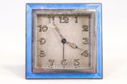 A 1930's enamel mounted Swiss bedside clock, 8.