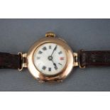 A yellow gold cased watch with ceramic Roman numeral dial. Hallmarked 9ct gold, 1912.