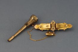 A Victorian hallmarked 9ct gold bar brooch and together with a bloodstone seal fob Gross weight: 8.