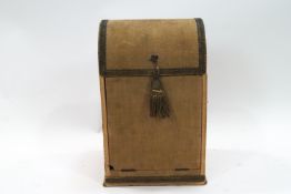 An early 19th century dome top case with gold thread tassel and braiding,