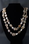 A long string of baroque style and fancy shaped freshwater cultured pearls. 205.