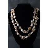 A long string of baroque style and fancy shaped freshwater cultured pearls. 205.