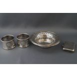 A silver pierced bon bon dish, a silver vesta case and a pair of silver napkin rings,