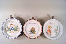 Three plate warmers printed with Mabel Lucie Atwell designs,
