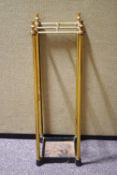 A brass stick stand of square form with four sections,