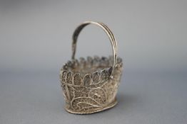 A white metal filigree basket 11.