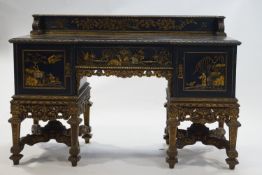 A 20th century carved and painted desk with Chinoiserie decoration of figures and birds within