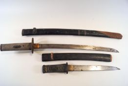 An early Japanese short sword and lacquered scabbard, pierced tsuba and shagreen grip,