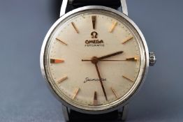 A gentlemans Omega Seamaster wrist watch. Automatic movement with front opening case.