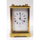 A brass framed four glass carriage clock, striking on a gong,