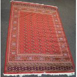 A Keshan style machine woven carpet with central medallion and all over floral decoration to the