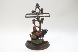 A painted cast iron stick and umbrella stand, modelled with a cockerel and hen,