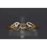 A yellow and white metal diamond ring with central oval brilliant diamond, approx 0.