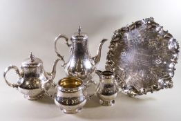 A four piece silver tea service of baluster form.