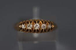 A yellow metal half hoop diamond ring approx 0.20ct. Hallmarked 18ct gold, Birmingham, 1915.