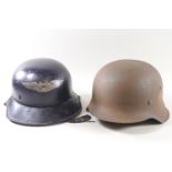 An M42 single decal German helmet and a Third Reich Air Defence helmet