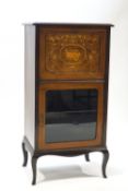 An Edwardian mahogany music cabinet,