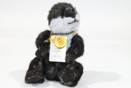 A Charlie Bear otter, 'Splish Splash', 33cm high, with tags, limited edition No 1174 of 2000,