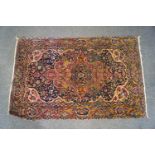 A Persian rug with central medallion,