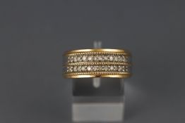A yellow and white metal half hoop diamond ring. Stated as 0.50ct. Colour: J/K Clarity: I2/3.