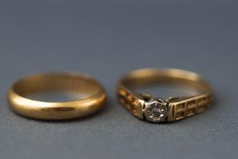 Two yellow metal rings,