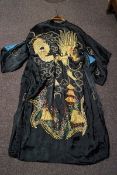 A Japanese reversible Kimono on one side embroidered with gold coloured threads with a dragon on a