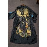 A Japanese reversible Kimono on one side embroidered with gold coloured threads with a dragon on a