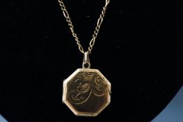 A yellow metal hexagonal locket pendant suspended from a figaro link chain. Hallmarked 9ct gold.